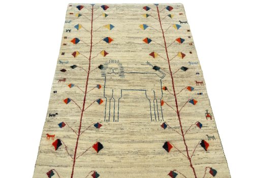 Surface texture of 2000s Persian Gabbeh rug with natural Wool and intricate pattern