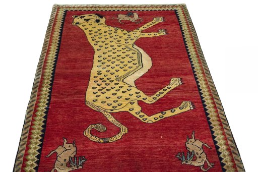 Surface texture of 2000s Persian Gabbeh rug with natural Wool and intricate pattern