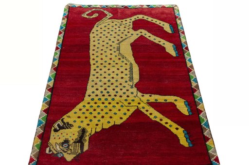 Surface texture of 2000s Persian Gabbeh rug with natural Wool and intricate pattern