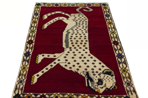 Surface texture of 2000s Persian Gabbeh rug with natural Wool and intricate pattern