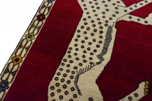 Backside of handmade 2000s Persian Gabbeh rug showing knot structure and weave density