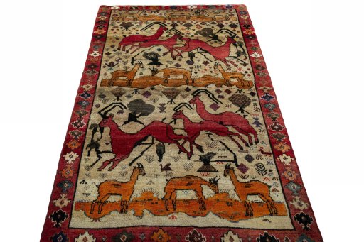 Surface texture of 2000s Persian Gabbeh rug with natural Wool and intricate pattern