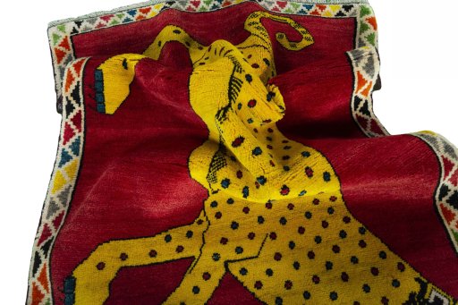 Corner detail of 2000s Persian Gabbeh rug showing border pattern and Wool pile