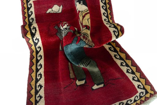 Corner detail of 2000s Persian Gabbeh rug showing border pattern and Wool pile