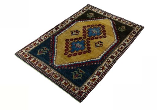 Corner detail of 2000s Persian Gabbeh rug showing border pattern and Wool pile