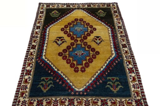 Surface texture of 2000s Persian Gabbeh rug with natural Wool and intricate pattern