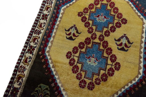 Backside of handmade 2000s Persian Gabbeh rug showing knot structure and weave density