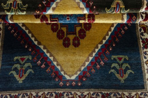 Full view of 2000s Persian Gabbeh rug from Iran / Persia, 160 × 109 cm in Yellow tones