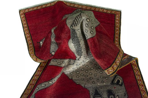 Corner detail of 2000s Persian Gabbeh rug showing border pattern and Wool pile