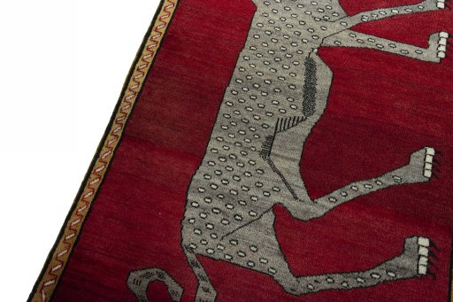 Backside of handmade 2000s Persian Gabbeh rug showing knot structure and weave density