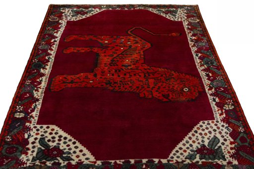 Surface texture of 2000s Persian Gabbeh rug with natural Wool and intricate pattern