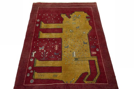 Surface texture of 2000s Persian Gabbeh rug with natural Wool and intricate pattern