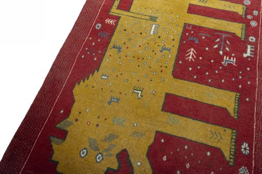 Backside of handmade 2000s Persian Gabbeh rug showing knot structure and weave density