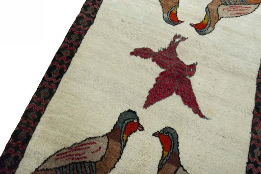 Backside of handmade 2000s Persian Gabbeh rug showing knot structure and weave density