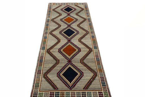 Surface texture of 2000s Persian Gabbeh rug with natural Wool and intricate pattern