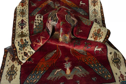 Corner detail of 2000s Persian Gabbeh rug showing border pattern and Wool pile