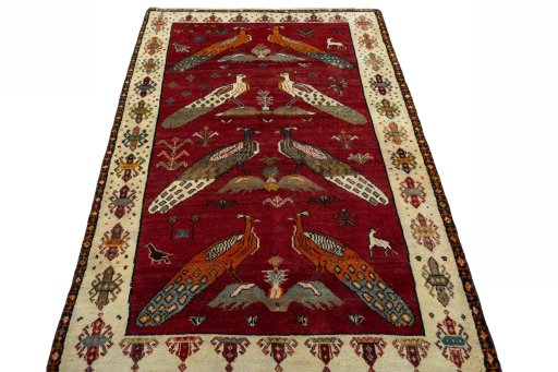 Surface texture of 2000s Persian Gabbeh rug with natural Wool and intricate pattern
