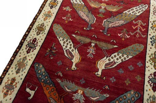 Backside of handmade 2000s Persian Gabbeh rug showing knot structure and weave density