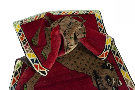 Corner detail of 2000s Persian Gabbeh rug showing border pattern and Wool pile