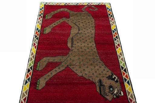 Surface texture of 2000s Persian Gabbeh rug with natural Wool and intricate pattern