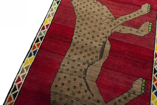Backside of handmade 2000s Persian Gabbeh rug showing knot structure and weave density
