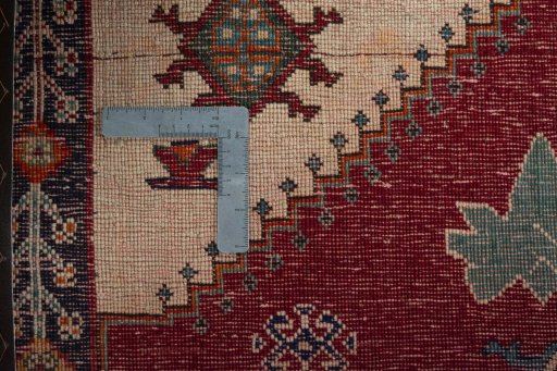 Surface texture of 2000s Persian Gabbeh rug with natural Wool and intricate pattern
