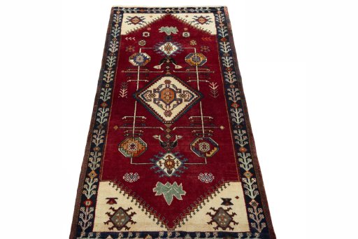 Surface texture of 2000s Persian Gabbeh rug with natural Wool and intricate pattern