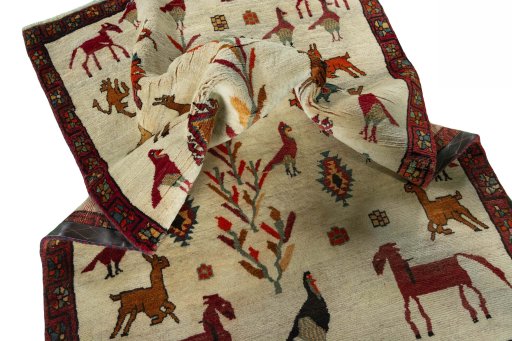 Corner detail of 2000s Persian Gabbeh rug showing border pattern and Wool pile