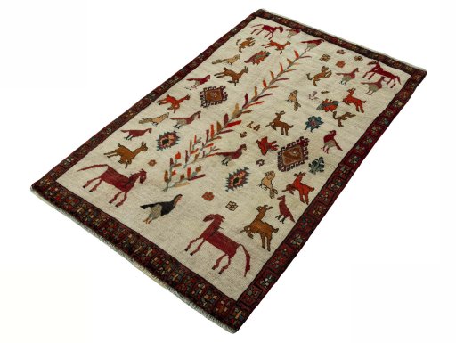 Corner detail of 2000s Persian Gabbeh rug showing border pattern and Wool pile