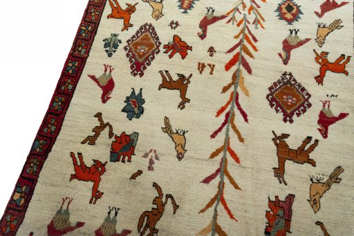 Backside of handmade 2000s Persian Gabbeh rug showing knot structure and weave density