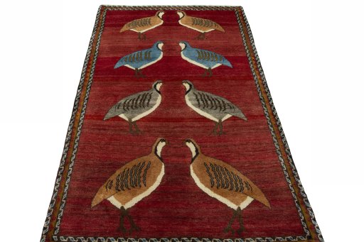 Surface texture of 2000s Persian Gabbeh rug with natural Wool and intricate pattern
