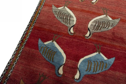 Backside of handmade 2000s Persian Gabbeh rug showing knot structure and weave density