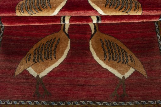 Full view of 2000s Persian Gabbeh rug from Iran / Persia, 215 × 124 cm in Red tones
