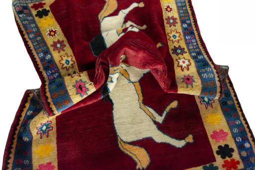 Corner detail of 2000s Persian Gabbeh rug showing border pattern and Wool pile