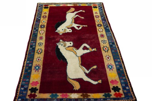 Surface texture of 2000s Persian Gabbeh rug with natural Wool and intricate pattern