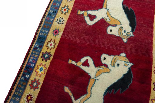 Backside of handmade 2000s Persian Gabbeh rug showing knot structure and weave density
