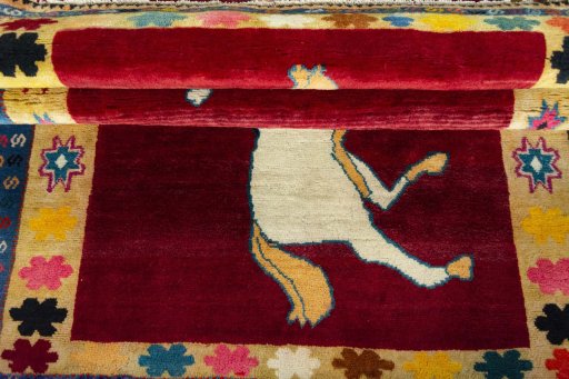 Full view of 2000s Persian Gabbeh rug from Iran / Persia, 184 × 122 cm in Red tones