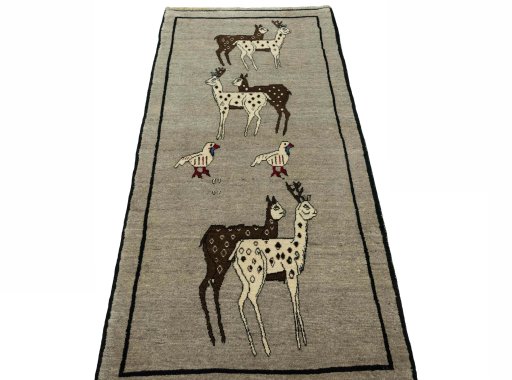 Surface texture of 2000s Persian Gabbeh rug with natural Wool and intricate pattern