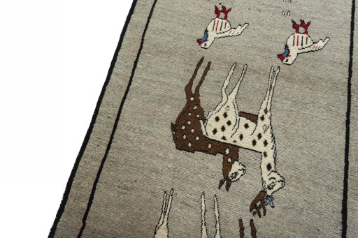 Backside of handmade 2000s Persian Gabbeh rug showing knot structure and weave density