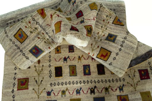 Corner detail of 2000s Persian Gabbeh rug showing border pattern and Wool pile