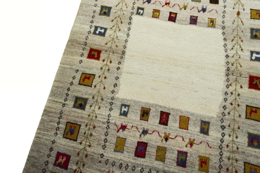 Backside of handmade 2000s Persian Gabbeh rug showing knot structure and weave density