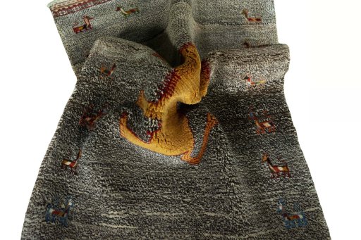 Corner detail of 2000s Persian Gabbeh rug showing border pattern and Wool pile