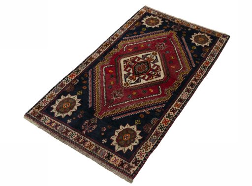 Corner detail of 2000s Persian Gabbeh rug showing border pattern and Wool pile