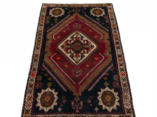 Surface texture of 2000s Persian Gabbeh rug with natural Wool and intricate pattern