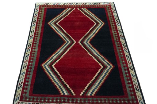 Surface texture of 2000s Persian Gabbeh rug with natural Wool and intricate pattern