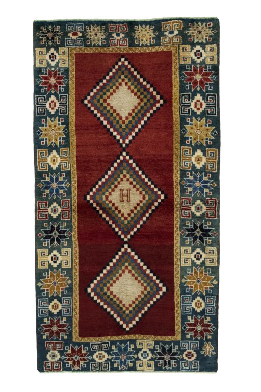 Full view of 2000s Persian Gabbeh rug from Iran / Persia, 156 × 83 cm in Red tones