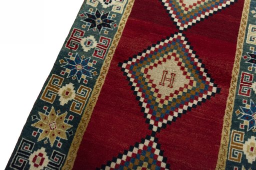 Backside of handmade 2000s Persian Gabbeh rug showing knot structure and weave density