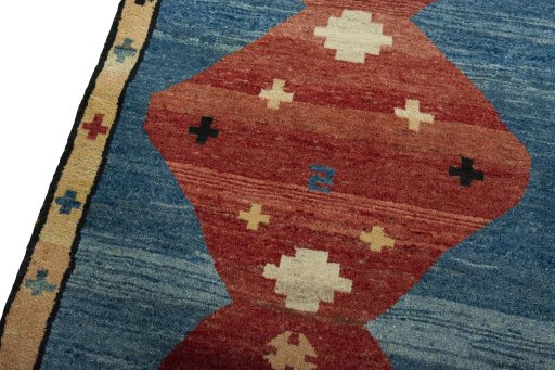 Backside of handmade 2000s Persian Gabbeh rug showing knot structure and weave density