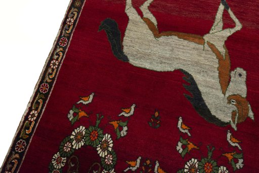 Backside of handmade 2000s Persian Gabbeh rug showing knot structure and weave density