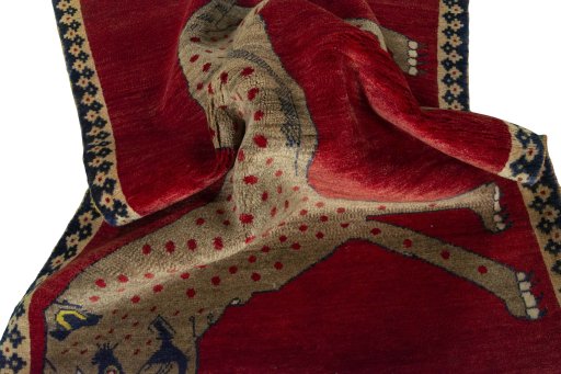 Corner detail of 2000s Persian Gabbeh rug showing border pattern and Wool pile